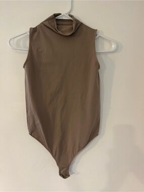 SKIMS Sleeveless High-Neck One-Piece Bodysuit in Taupe